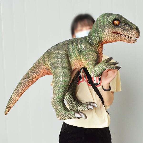 Dinosaurio bebé animatronicó con muñeca de mano Velociraptor